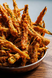 The Tamil Prince signature dishes Okra FriesPrince's Special Masala DosaChettinad Lamb Curry
